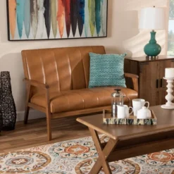 Nikko Mid-Century Faux Leather Upholstered Wood Loveseat Walnut/Brown - Baxton Studio 12 Nikko Mid-Century Faux Leather Upholstered Wood Loveseat Walnut/Brown - Baxton Studio -Baxton Studio Shop GUEST d1496ae9 9e7b 4c99 a39c b224c1b080f8